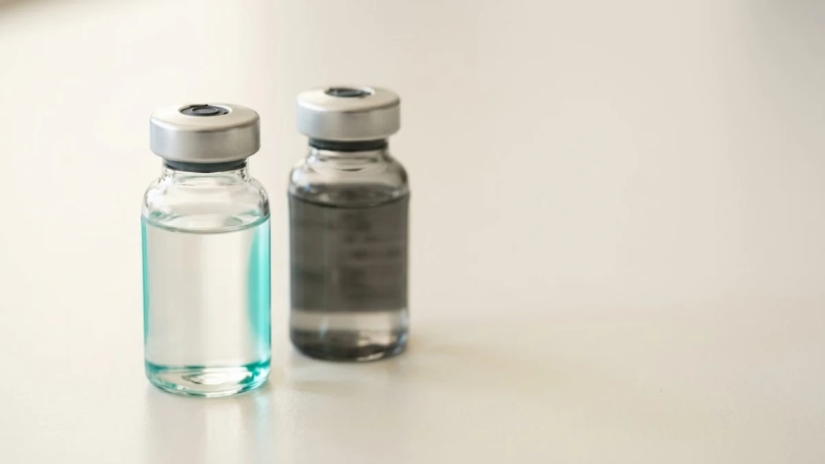Two clear glass peptide vials on a light surface