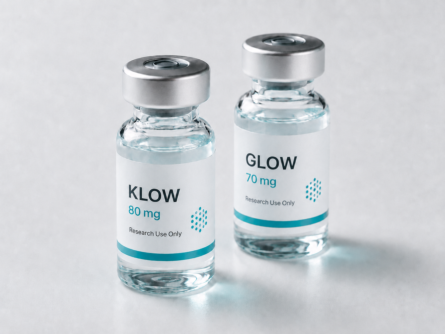 GLOW and KLOW vials side by side on a white surface