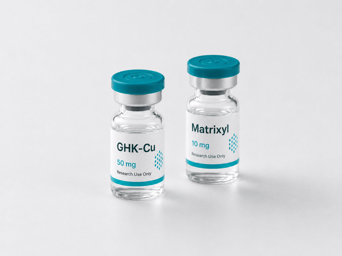 Two research vials labeled GHK-Cu 50 mg and Matrixyl 10 mg side by side on a light surface